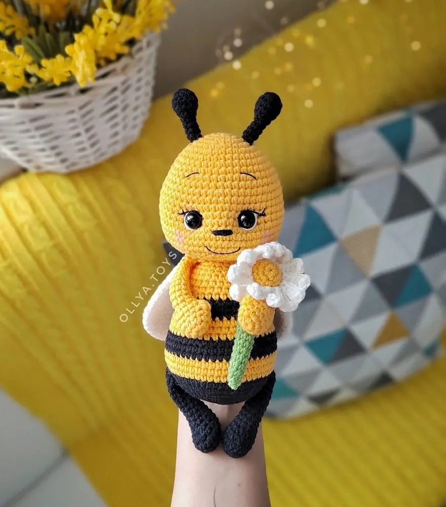 Cute honey bee with chamomile